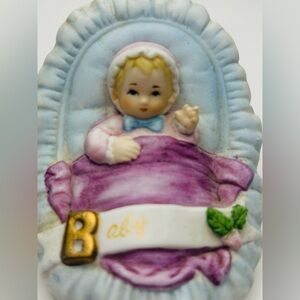 Enesco vintage ‘83 Newborn Baby Girl Figurine with Purple and Gold Accents.
